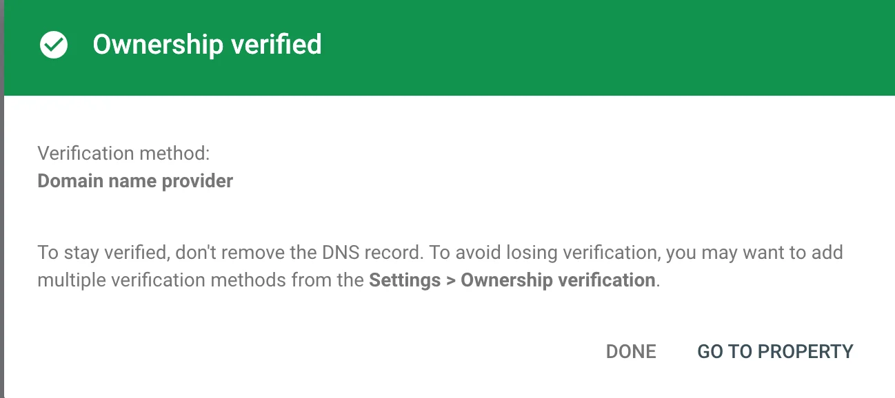 Captura de Google Search Console: ventana verde "Ownership verified" con el método de verificación "Domain name provider"