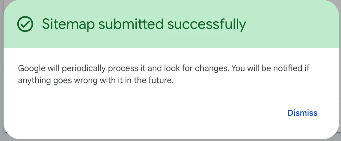 Notificación de Google Search Console "Sitemap submitted successfully" con un check verde y el botón Dismiss